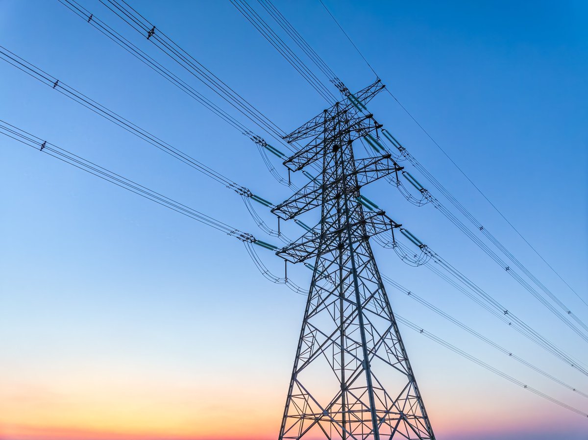 High voltage electricity tower and natural scenery at sunset